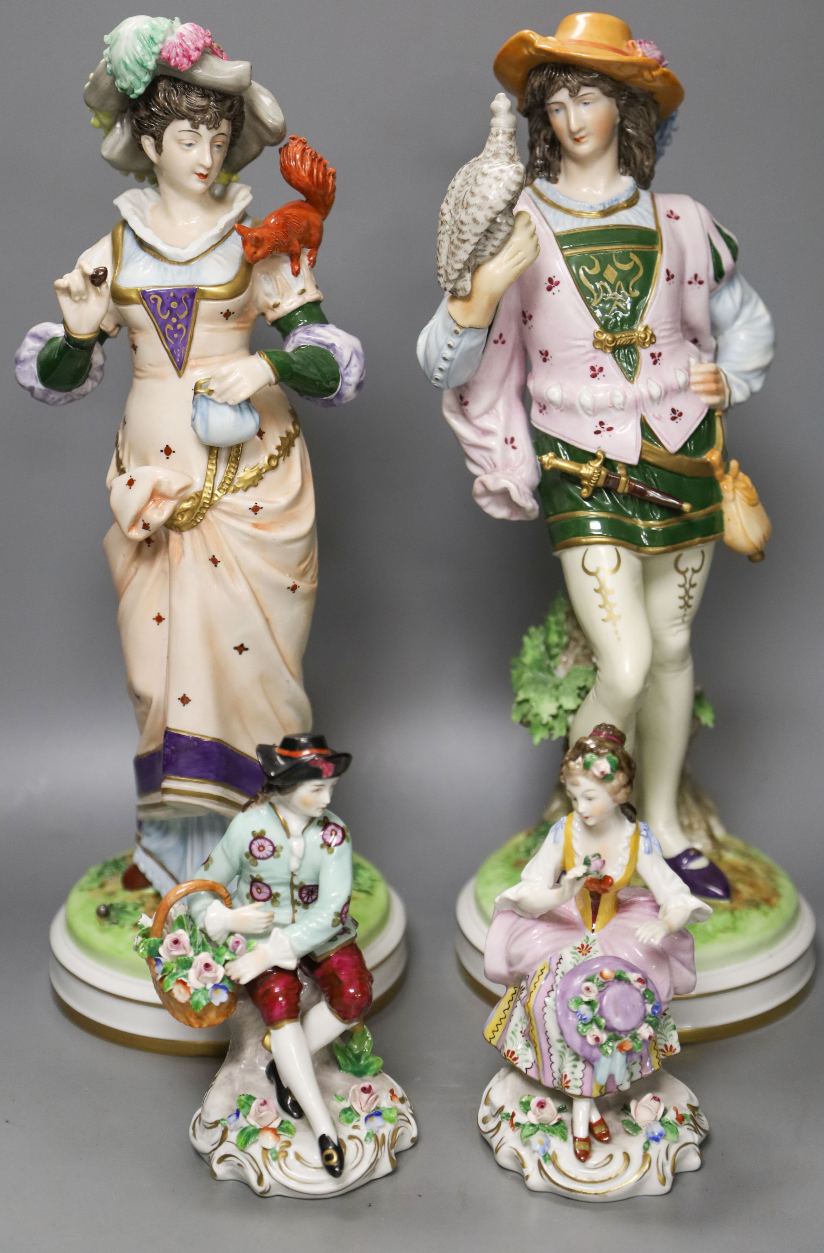 Two pairs of Continental porcelain figures, 35cm